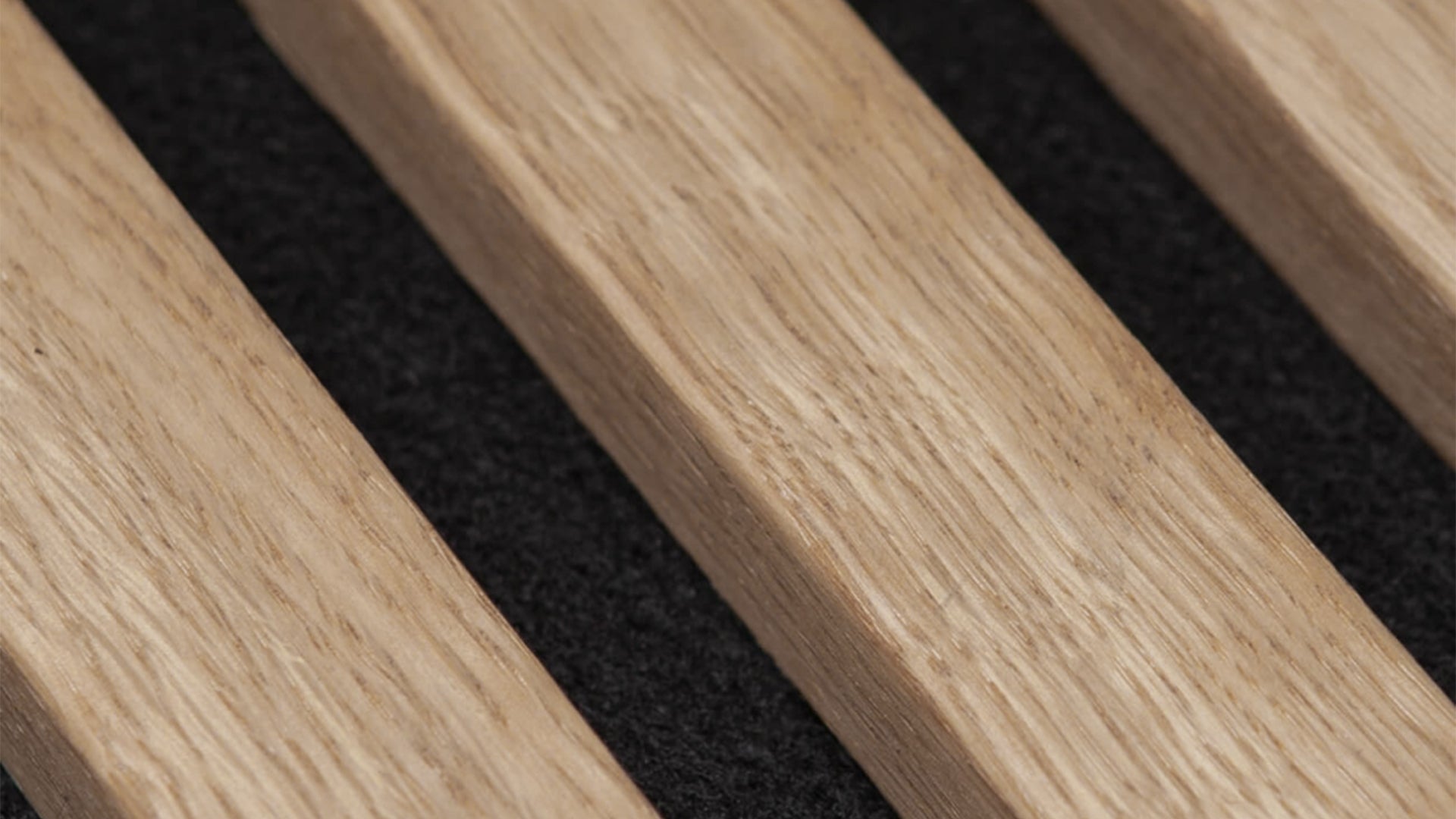 Acoustic slat panel detail showcasing slat spacing for sound absorption.